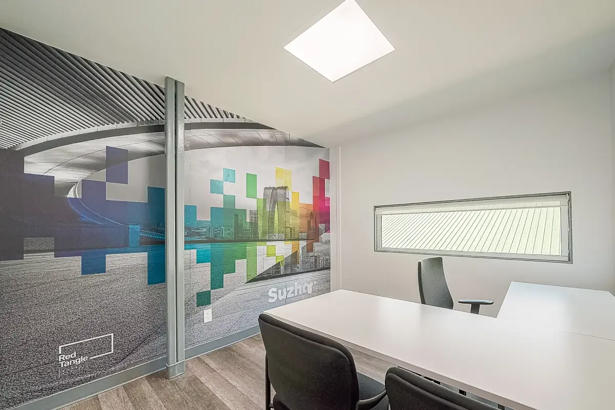 Furnished private office suite with ergonomic desk seating at Red Tangle Workspaces in Magnolia, TX