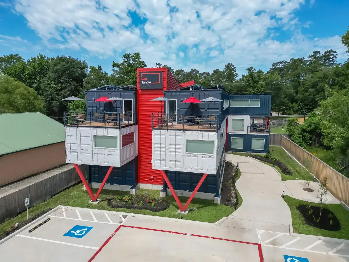 Shared lounge with soft seating and café area at Red Tangle Workspaces