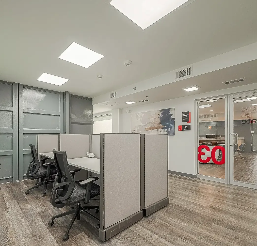 Open coworking area with private workstations at Red Tangle Smart Offices, Magnolia, Texas