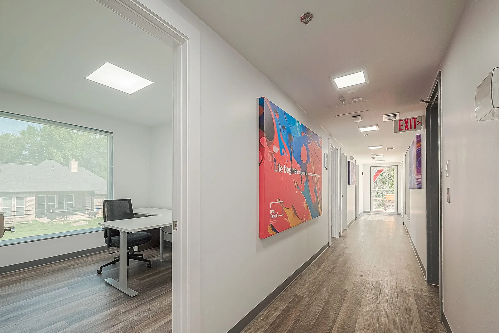 Private office suite with desk, task chair and natural light at Red Tangle Smart Offices, Magnolia, Texas